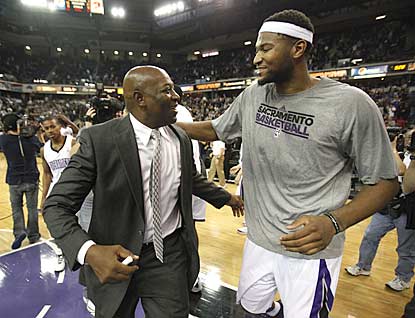 Interim coach Keith Smart and DeMarcus Cousins, who clashed with Paul Westphal, embrace after Sacramento's stunning comeback.  (AP)