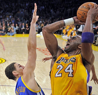 Neither a bad wrist nor a jam-packed schedule slows down Kobe Bryant, who scores 39 points, including 26 in the second half. (AP)