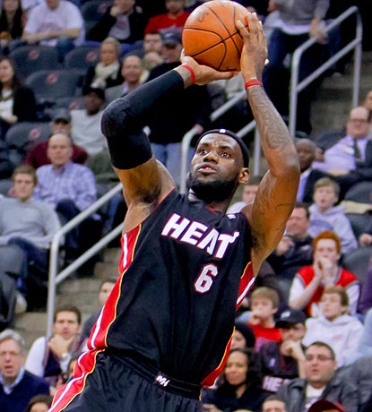LeBron James returns to the Heat's lineup in a huge way, scoring 32 points against New Jersey. (US Presswire)