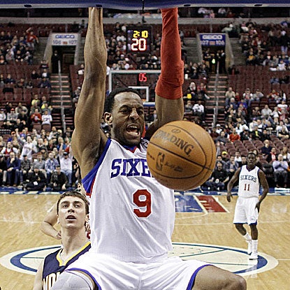 Andre Iguodala dunks home two of his game-high 20 points for the first-place 76ers.  (AP)