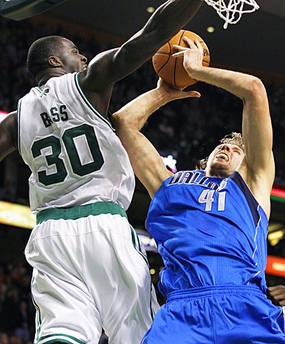 Dallas' Dirk Nowitzki drives for the winning basket in the final seconds against the Celtics. (AP)