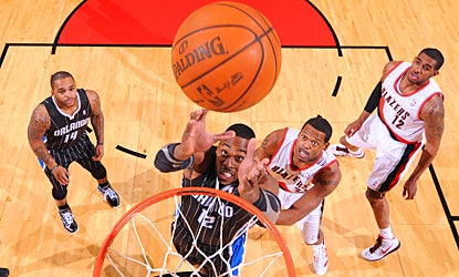 The Magic's Dwight Howard grabs one of his game-high 13 rebounds against the Trail Blazers.  (Getty Images)