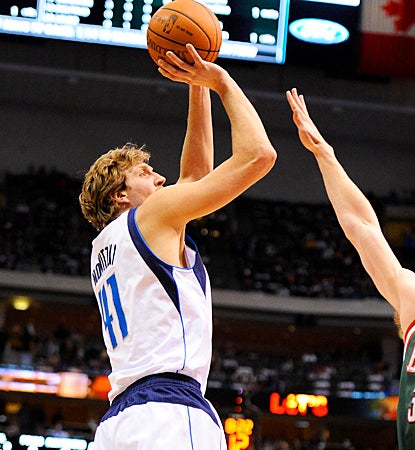 Dirk Nowitzki shoots for two of his 11 points, putting him over 23,000 points for his career. (US Presswire)