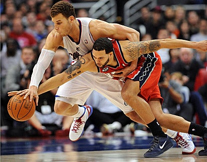 Blake Griffin (23 points, 14 rebounds) battles New Jersey's Deron Williams (14 points) for a loose ball in the Clippers' win. (US Presswire)