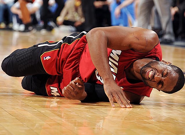 After spraining his left ankle in Denver on Friday, Wade has yet to return to practice. (Getty Images)