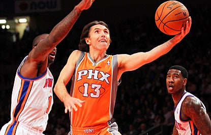 Steve Nash drives for two of his 26 points against the Knicks, who lose their fourth straight game. (US Presswire)