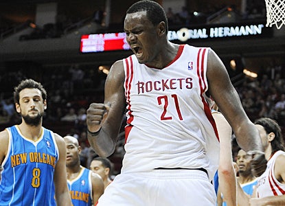 Samuel Dalembert celebrates after scoring a basket for two of his 15 points against the Hornets. (AP)