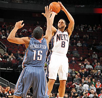The Nets' Deron Williams scores 19 points and dishes out 10 assists, missing a triple-double by one rebound.  (Getty Images)