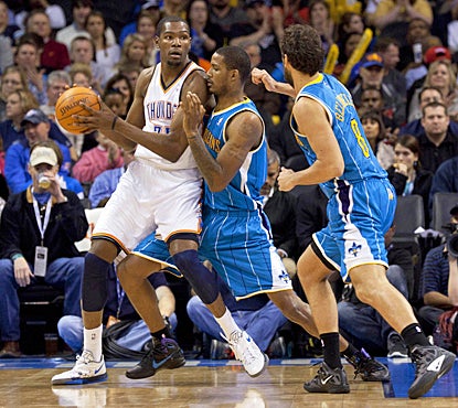 The Thunder's Kevin Durant looks to make a pass during the third quarter against the Hornets. (US Presswire)