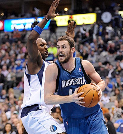 Kevin Love, shown driving around Lamar Odom in the third quarter, registers his 16th consecutive double-double.  (US Presswire)