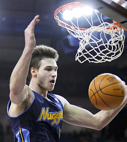 Denver's Danilo Gallinari finishes a dunk for two of his game-high 23 points against the Kings. (US Presswire)