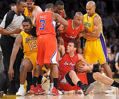 Blake Griffin winds up on the floor as tempers flare between the intra-arena rivals in the second half.  (US Presswire)