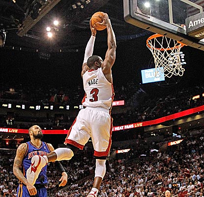The Heat had won eight of nine games without Dwyane Wade, who finishes one of Miami's many highlight-reel plays.  (Getty Images)