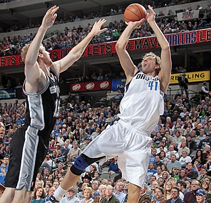 Dirk Nowitzki only scores 10 points, but he also grabs 13 boards in maybe the most exciting game of the year.  (Getty Images)