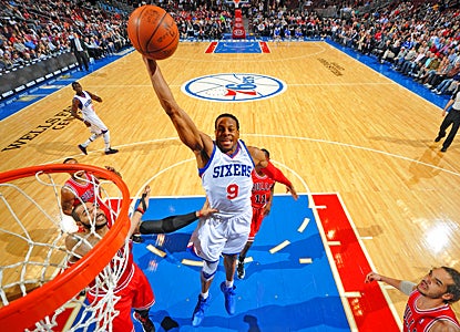Andre Iguodala flies over the Bulls' defense for 19 points and nine rebounds in the Sixers' win. (Getty Images)