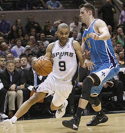 Tony Parker, on his way to an 18-point evening, drives his way around Jason Smith in the first half.  (US Presswire)