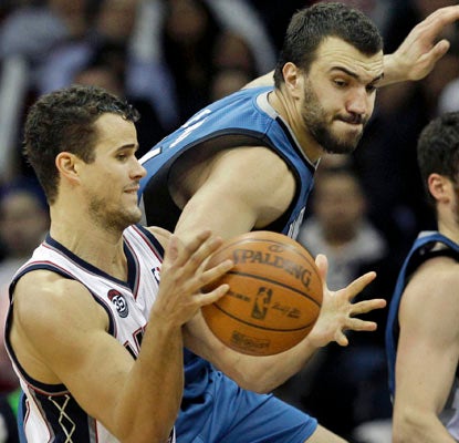 Nikola Pekovic (right) gets in the mix for the Timberwolves, scoring a career-high 27 points and grabbing 11 rebounds.  (AP)