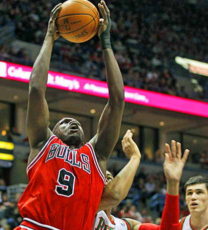 The Bulls' Luol Deng drives to the basket for two of his 21 points in his return against the Bucks. (AP)