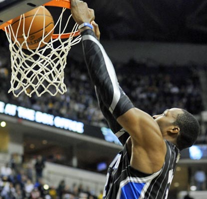 Dwight Howard scores 27 points and grabs eight boards as the Magic squeak one out against a tough Pacer squad.  (AP)