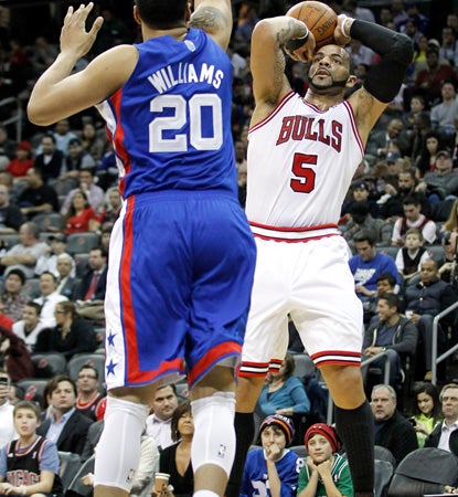 Carlos Boozer is the high man in the game with 24 points to lead the Rose-less Bulls in a rout of the Nets. (AP)