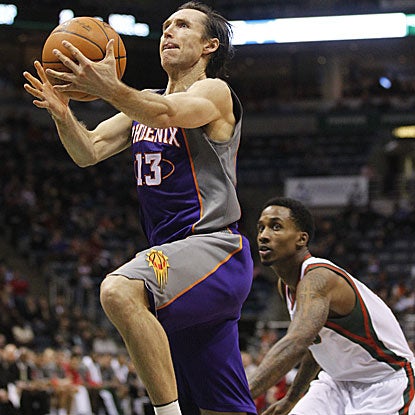 The Suns' Steve Nash celebrates his 38th birthday by scoring the game-winning basket with five seconds remaining in regulation. (AP)