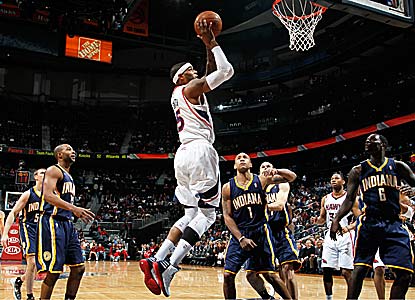Josh Smith contributes 28 points and 12 rebounds for Atlanta, which ends a three-game home losing skid. (Getty Images)