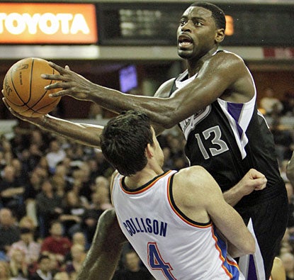 Tyreke Evans drives to the basket over Nick Collison, as the Kings guard finishes with 22 points on the night. (AP)