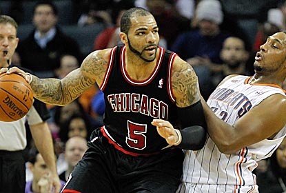 With Derrick Rose out, the Bulls run their offense through Carlos Boozer, who scores 16 points.  (Getty Images)