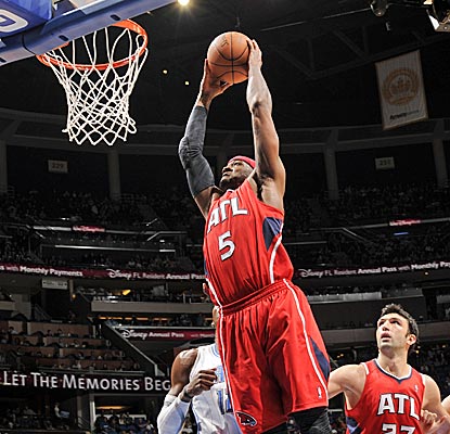Josh Smith plays huge, scoring 23 points and grabbing 19 boards as the Hawks win in overtime.  (Getty Images)