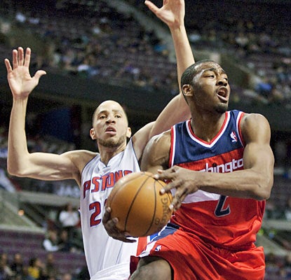 John Wall stays busy looking for open teammates and finishes the game with a season-high 15 assists. (AP)