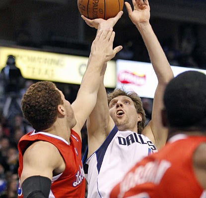 Dirk Nowitzki gets going late as he scores 11 of his 22 points with less than seven minutes remaining in the game. (AP)