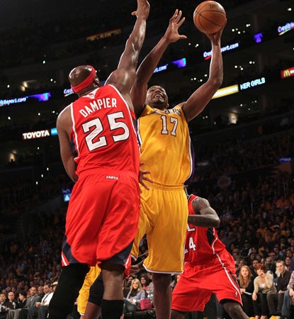 Andrew Bynum goes up for two of his 15 points, and adds 15 boards to help the Lakers top the Hawks. (Getty Images)