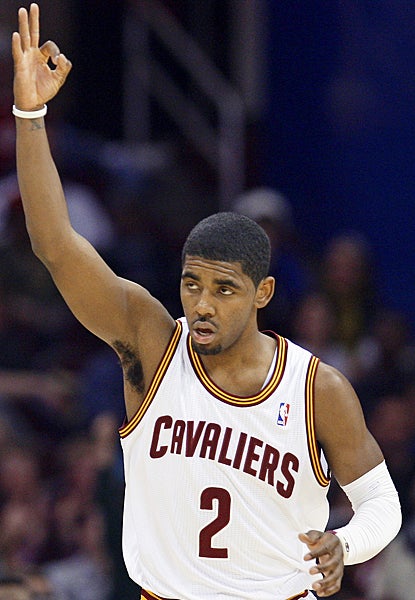 Cleveland's Kyrie Irving signals to the crowd after drilling a 3-pointer against the Pacers. (AP)