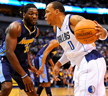 The Mavericks' Shawn Marion drives the ball past the Nuggets' Kenneth Faried in the first quarter. (US Presswire)