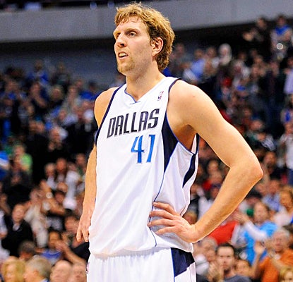 Dirk Nowitzki reacts after getting into the top 20 on the NBA's career scoring list. (US Presswire)
