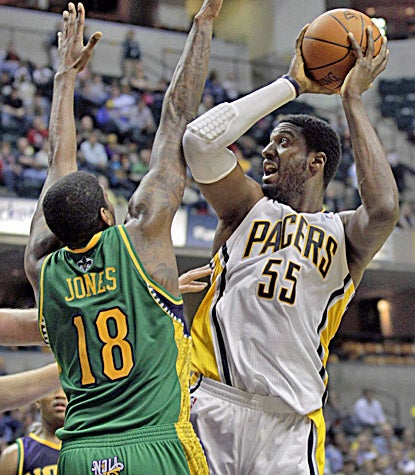 Roy Hibbert finishes with a career-high 30 points in the Pacers' 117-108 overtime win over the Hornets. (AP)