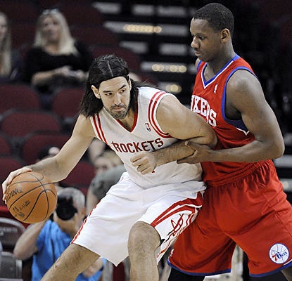 The Rockets' Luis Scola puts up a game-high 19 points and also leads all players in rebounds with 10.  (AP)