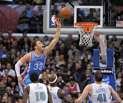 Blake Griffin is head and shoulders over the Denver Nuggets defense during a 27-point, 12-rebound performance.  (US Presswire)