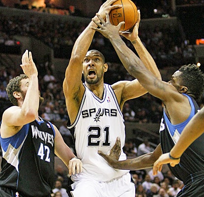 The Spurs' Tim Duncan works through the Timberwolves' defense for 21 points and 15 rebounds. (US Presswire)