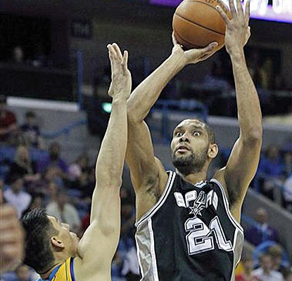Tim Duncan scores the biggest four of his 13 points inside the last two minutes as the Spurs escape.  (AP)