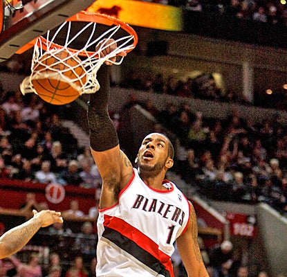 LaMarcus Aldridge slams home two of his 18 points against the Warriors as the Blazers improve to 3-3 under Kaleb Chambers. (US Presswire)