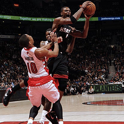 Chris Bosh scores 30 points and grabs eight rebounds as the Heat defeat the Raptors for the seventh straight time.  (Getty Images)