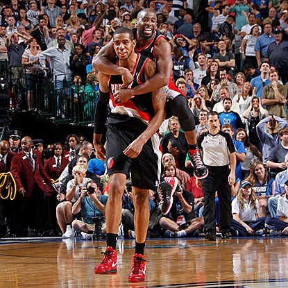 Raymond Felton leaps on LaMarcus Aldridge after he hits the game-winning jumper for the Trail Blazers.  (Getty Images)