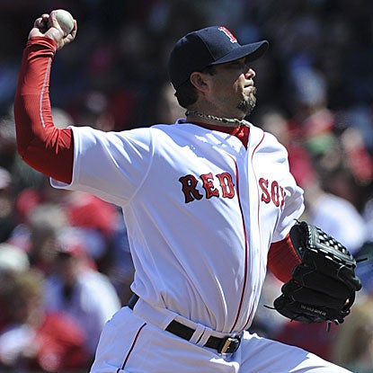 Josh Beckett allows one earned run on five hits in eight innings to win the Red Sox's eighth consecutive home opener.  (US Presswire)