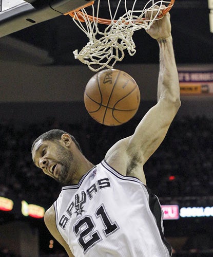 Time Duncan (19 points, 11 rebounds) helps San Antonio remain just one game behind Oklahoma City for the West's No. 1 seed.  (AP)