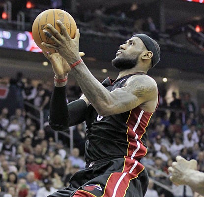 Trailing the entire game, LeBron James takes over late in the fourth by scoring 17 straight points to lift Miami to a win. (AP)