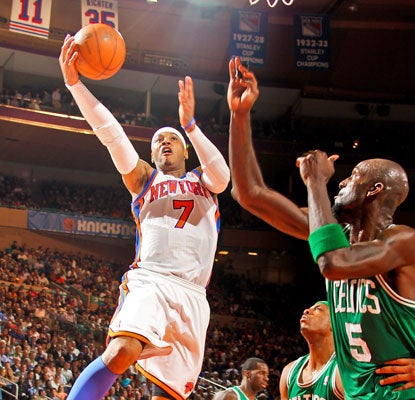 Carmelo Anthony cuts through the Celtics for his second career triple-double -- 35 points, 12 rebounds and 10 assists.  (Getty Images)