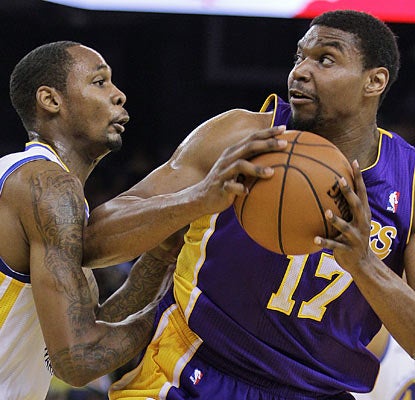 Mickell Gladness has no luck containing Andrew Bynum, who goes off for 31 points and nine boards in the Lakers' win. (AP)