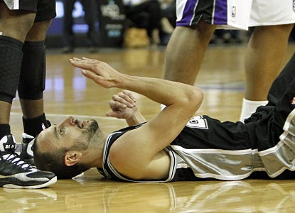 Manu Ginobili plays limited minutes, but still finds time to take a couple of bumps before finishing with 13 points. (AP)