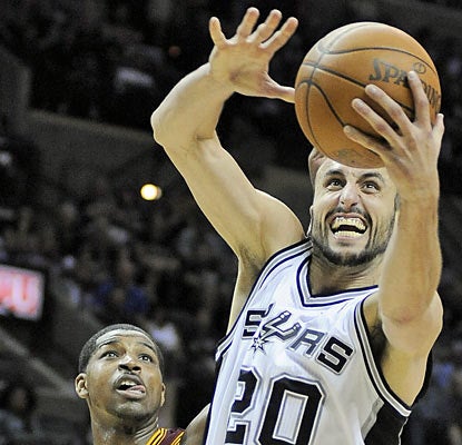 Manu Ginobili (20 points) lends a hand as the Spurs reel out their seventh consecutive win. (AP)